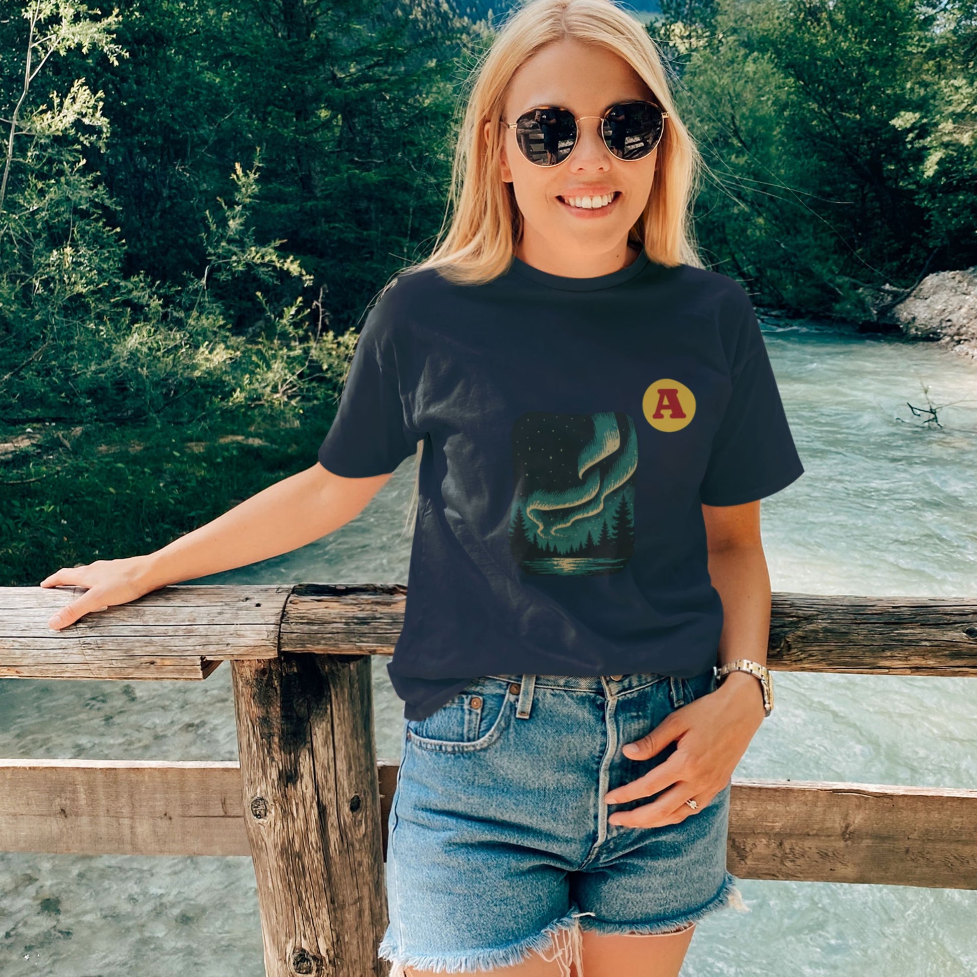 Woman wearing a Navy Northern lights Aurora T shirt from the Canadian ABC collection by Maple Beaver