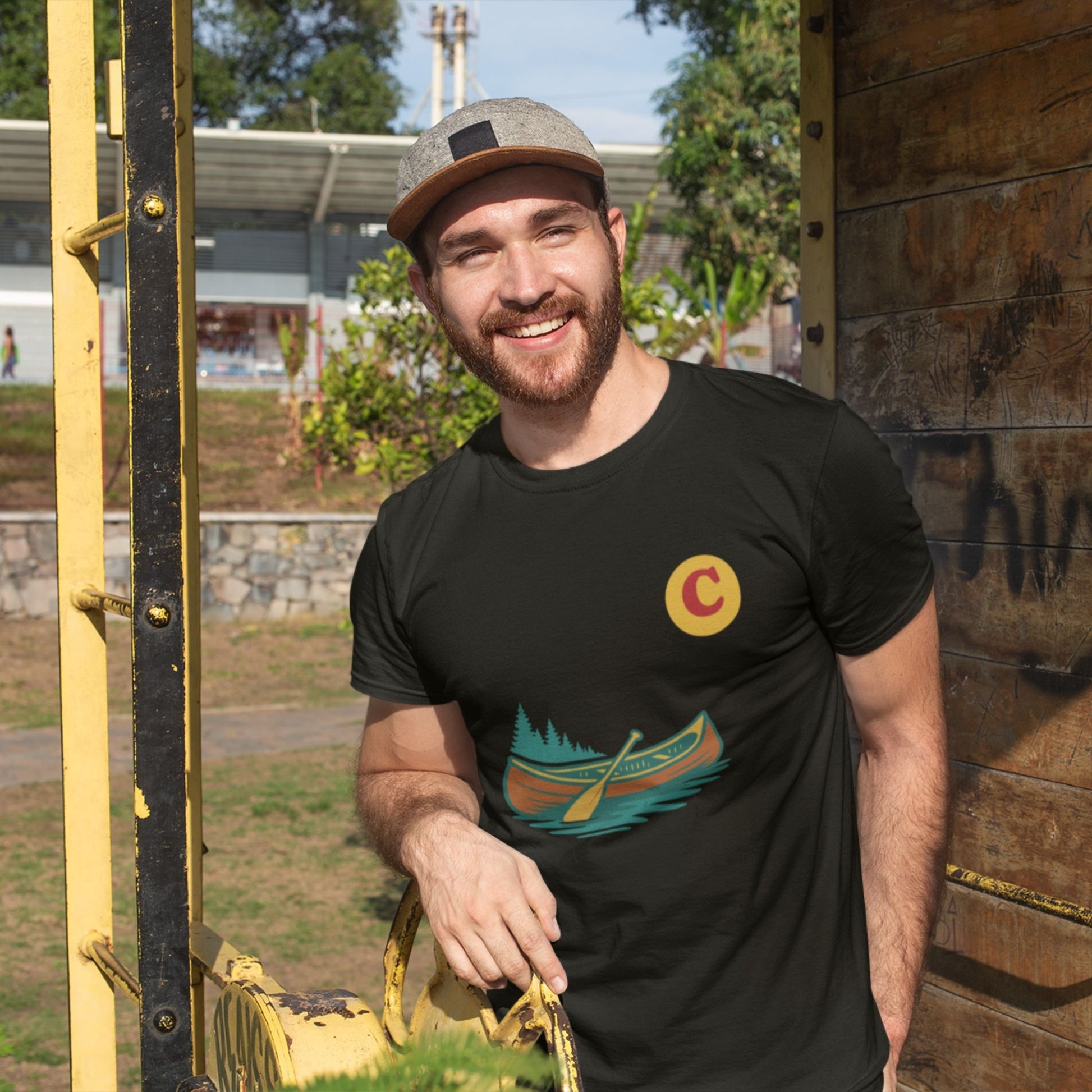Man wearing a Canadain Canoe T Shirt in Black colour from the Canadian ABC collection by Maple Beaver