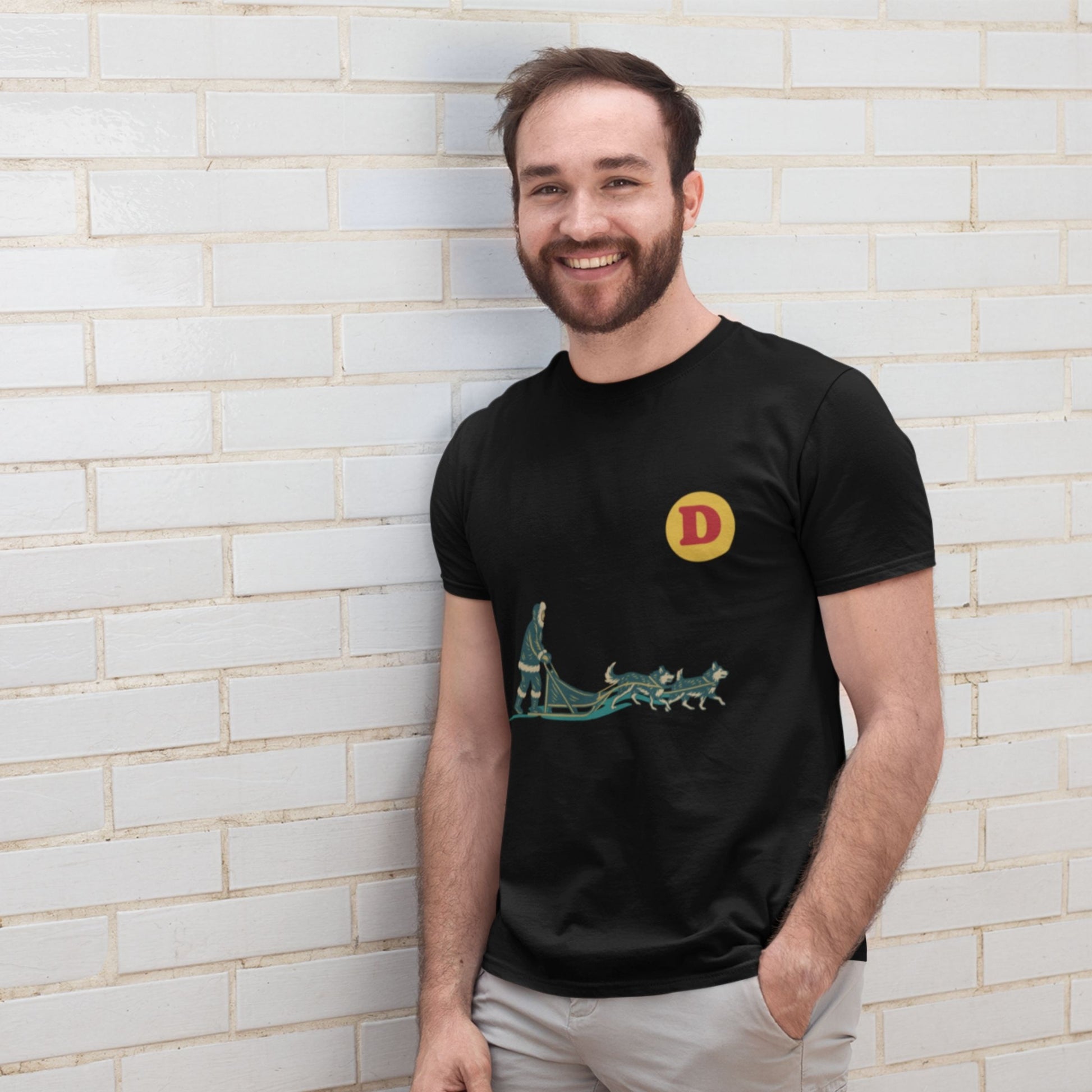 Man wearing a black colour Canadian Dog Sled T shirt from the Canadian ABC collection by Maple Beaver