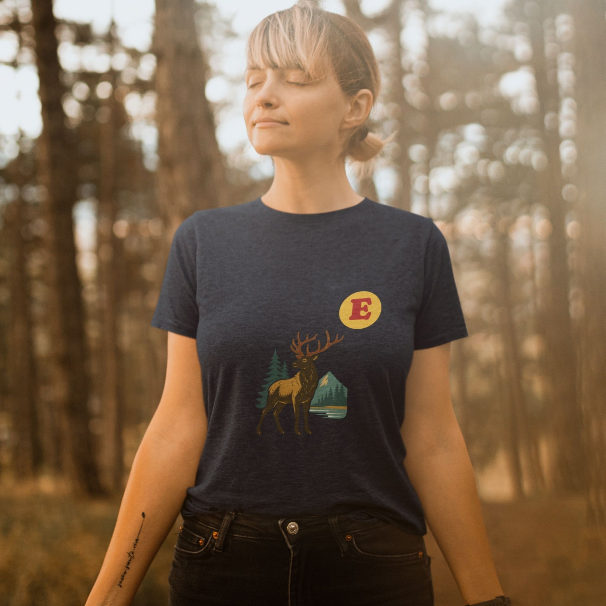 Woman wearing a Canadain Elk T Shirt in Navy colour from the Canadian ABC collection by Maple Beaver