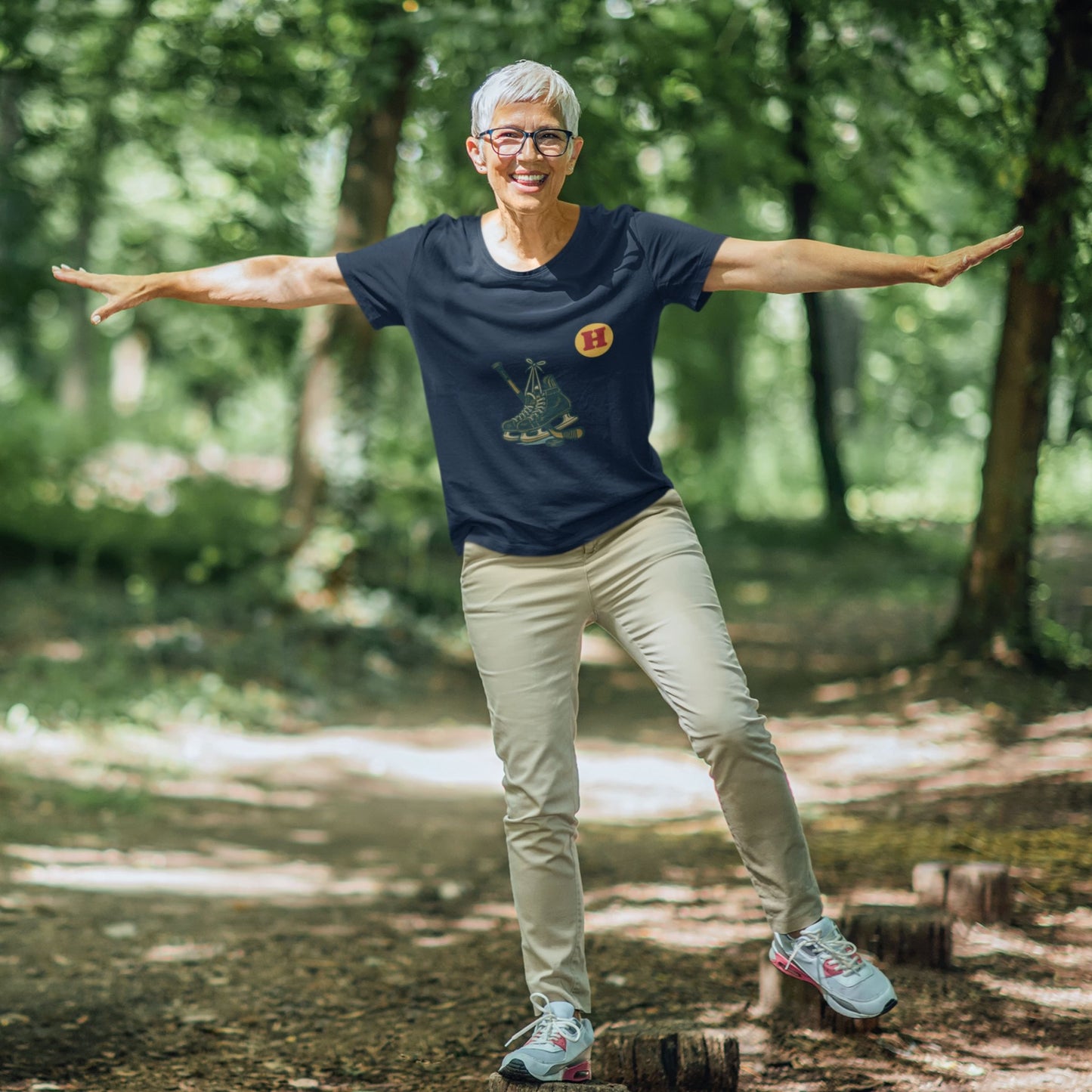 Woman wearing a Navy colour Canadian Made Hockey T Shirt in Organic Cotton from the Canadian ABC collection by Maple Beaver