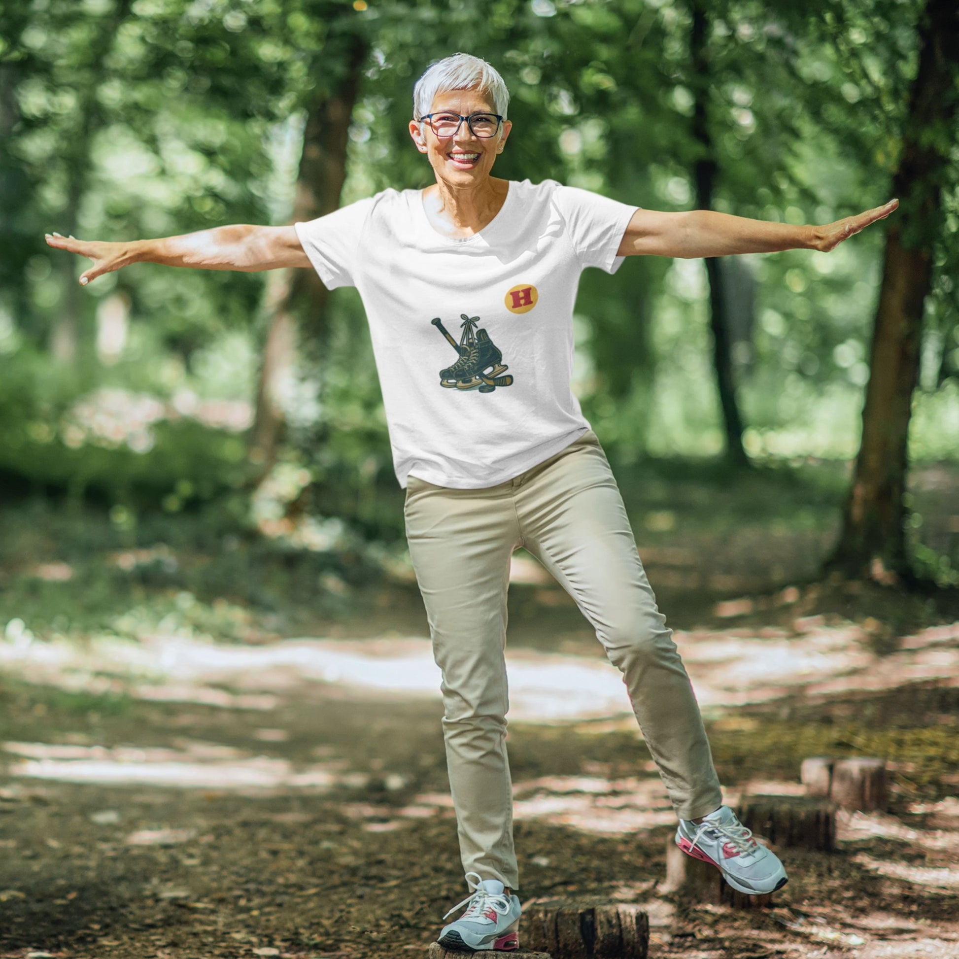 Woman wearing a White colour Canadian Made Hockey T Shirt in Organic Cotton from the Canadian ABC collection by Maple Beaver