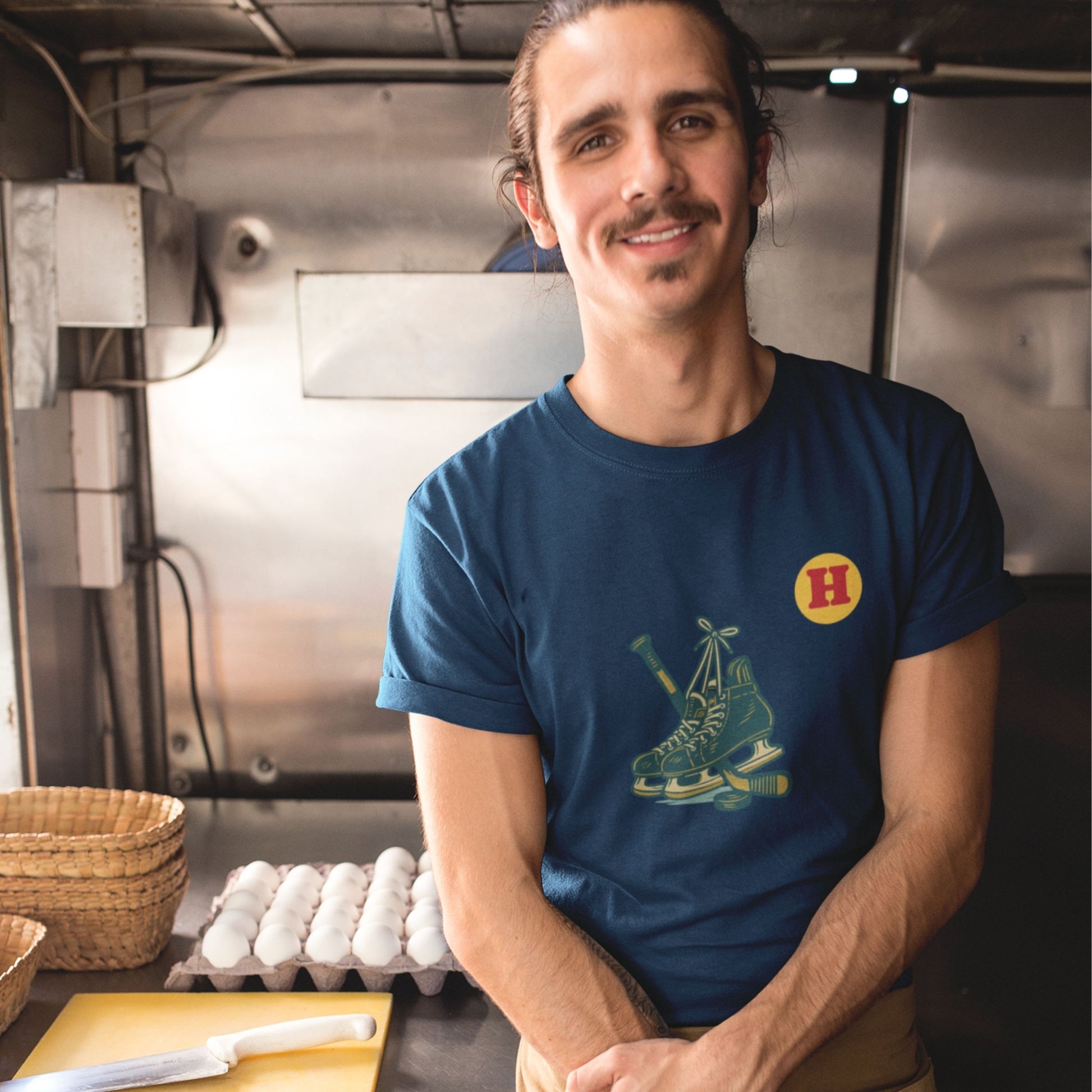 Man wearing a Navy colour Canadian Made Hockey T Shirt in Organic Cotton from the Canadian ABC collection by Maple Beaver