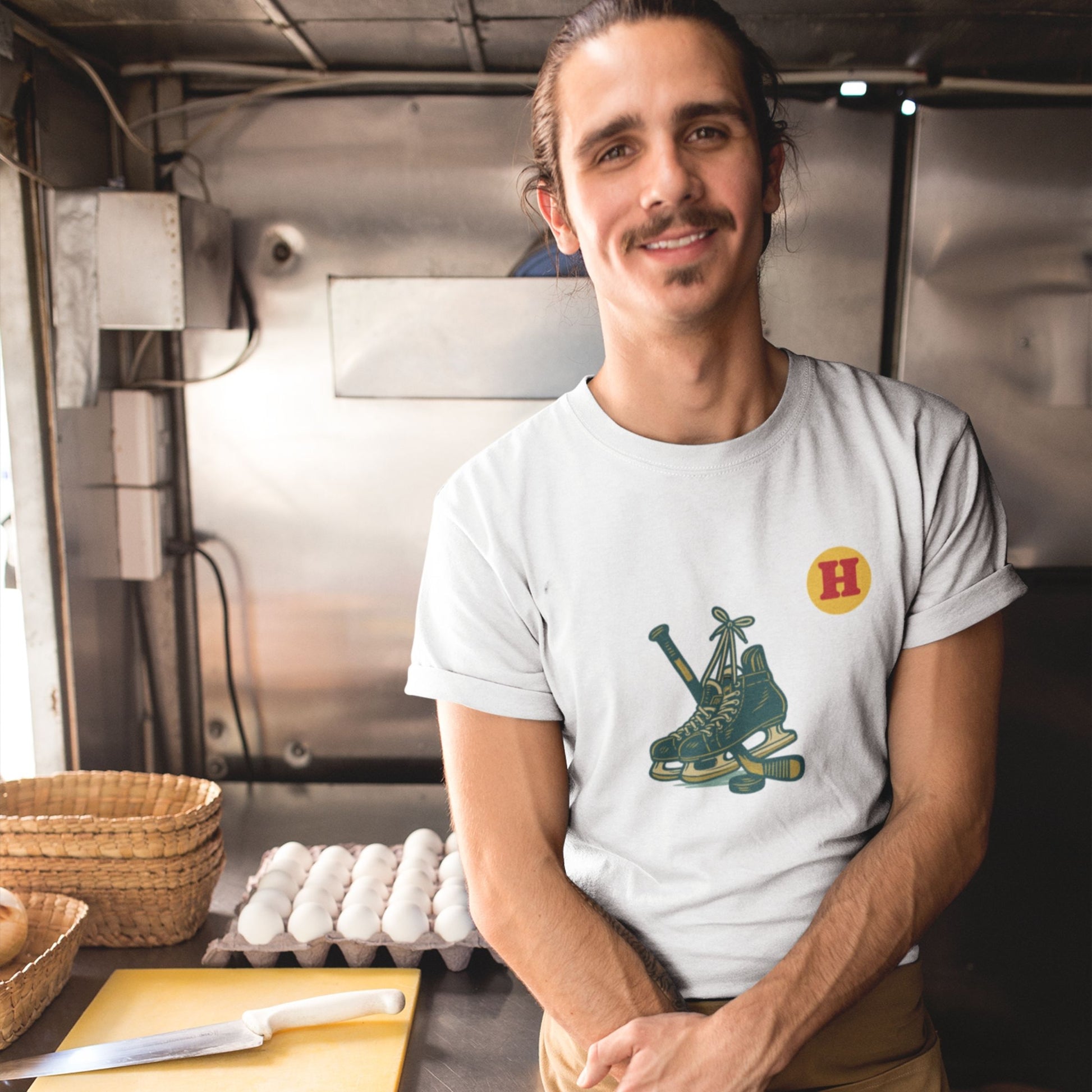 Man wearing a White colour Canadian Made Hockey T Shirt in Organic Cotton from the Canadian ABC collection by Maple Beaver