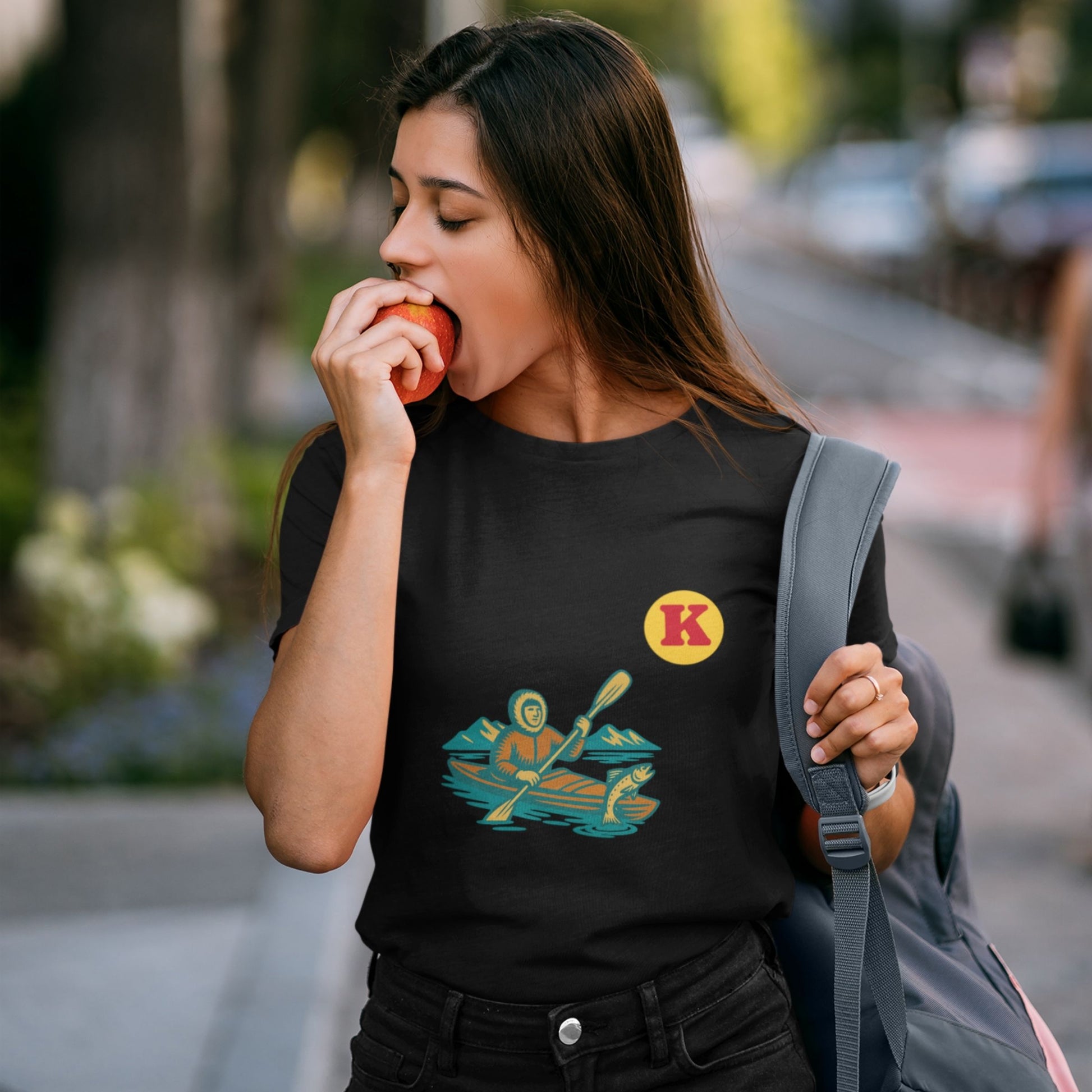 Woman wearing a Black colour Canadian Made T shirt featuring the Kayak from the Canadian ABC collection by Maple Beaver