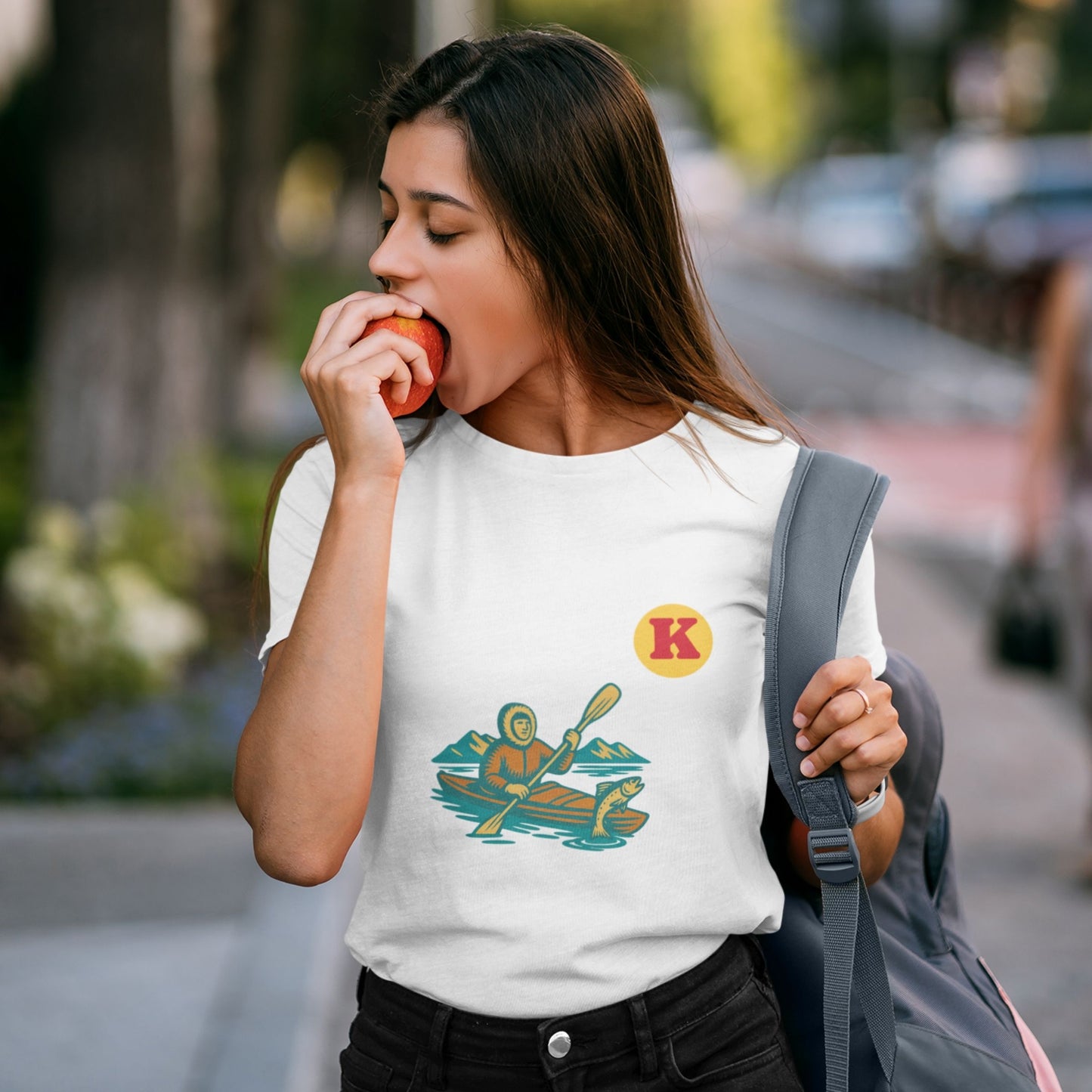 Woman wearing a White colour Canadian Made T shirt featuring the Kayak from the Canadian ABC collection by Maple Beaver