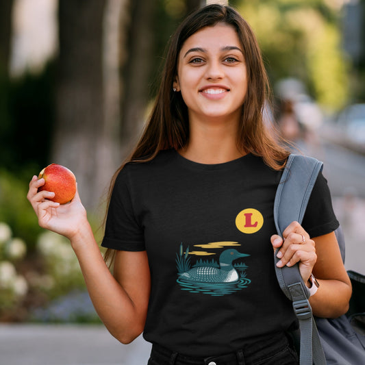 Woman wearing a Black colour Canadian Made T shirt featuring the Loon Duck from the Canadian ABC collection by Maple Beaver