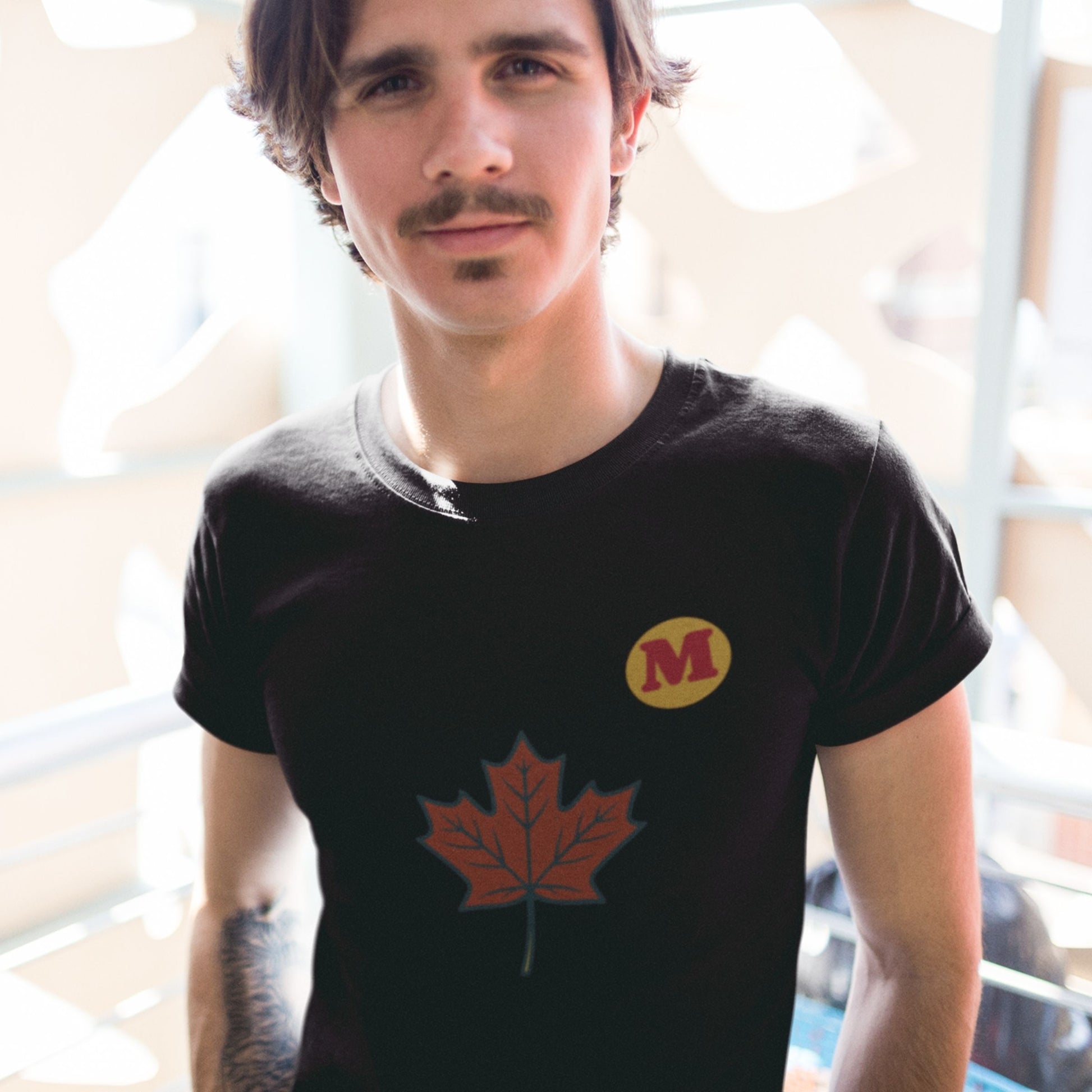 Woman wearing the Maple Leaf Canada T shirt in Black colour from the Canadian ABC collection by Maple Beaver