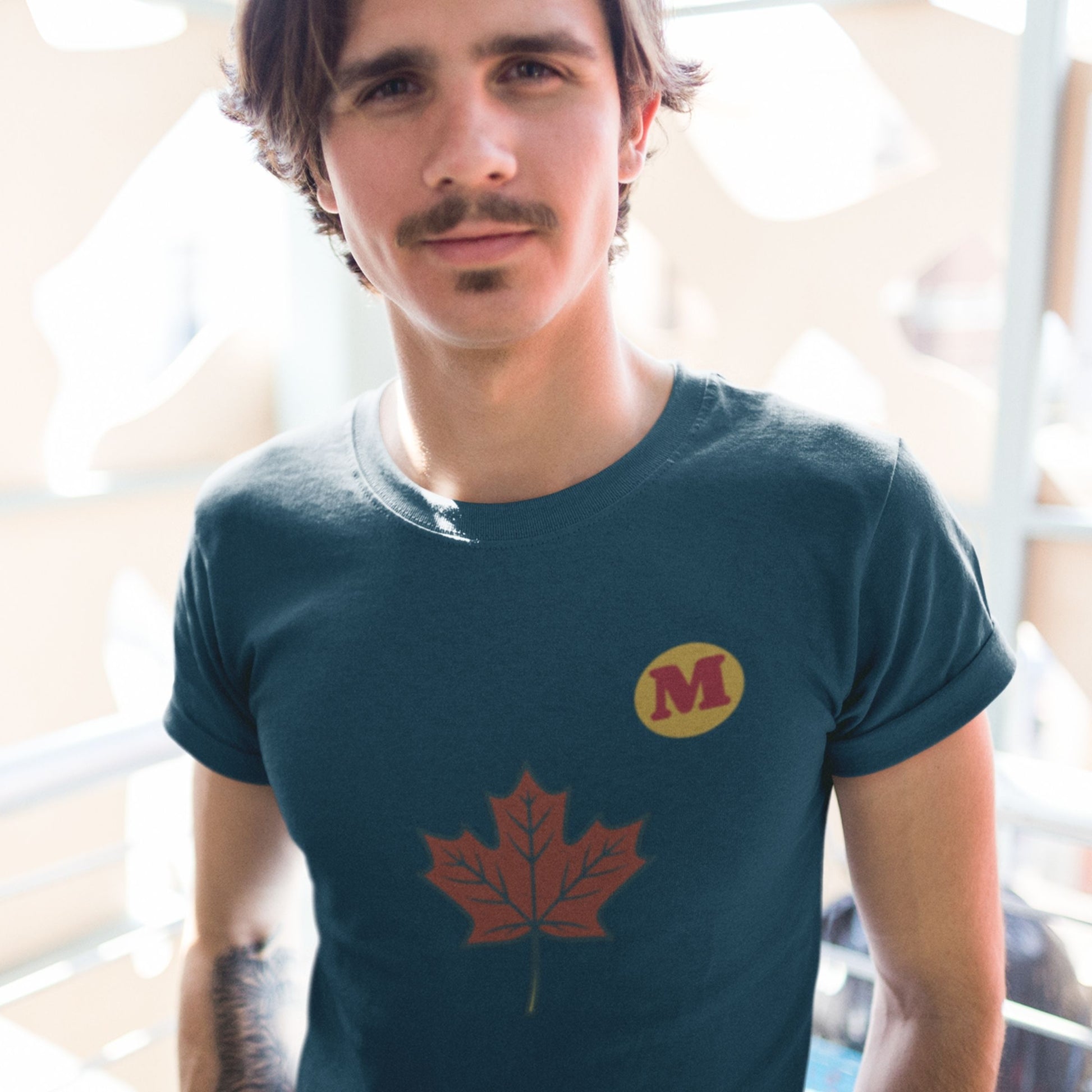 Man wearing the Maple Leaf Canada T shirt in Navy colour from the Canadian ABC collection by Maple Beaver