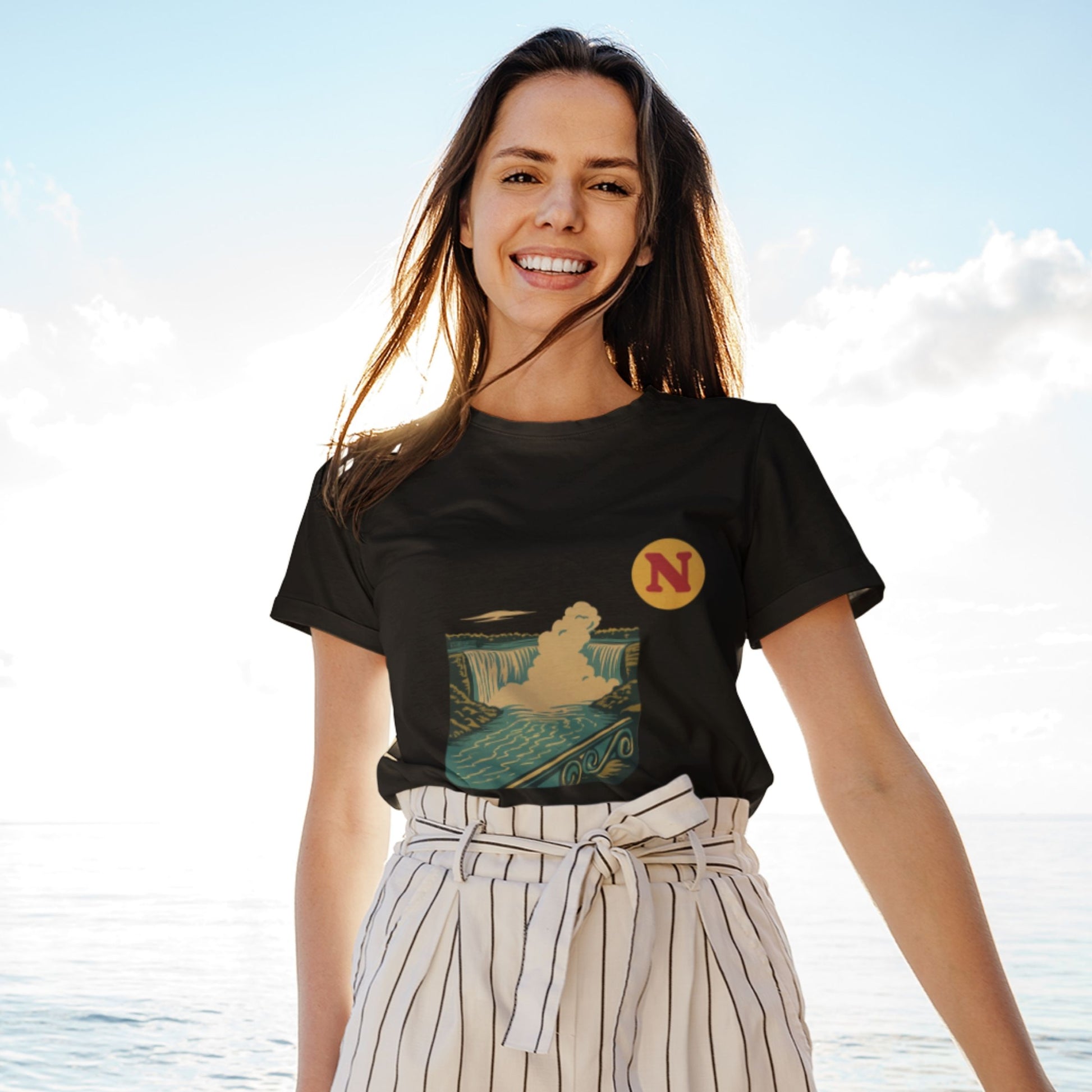Woman wearing the Niagara Falls Canada T shirt in Black colour from the Canadian ABC collection by Maple Beaver