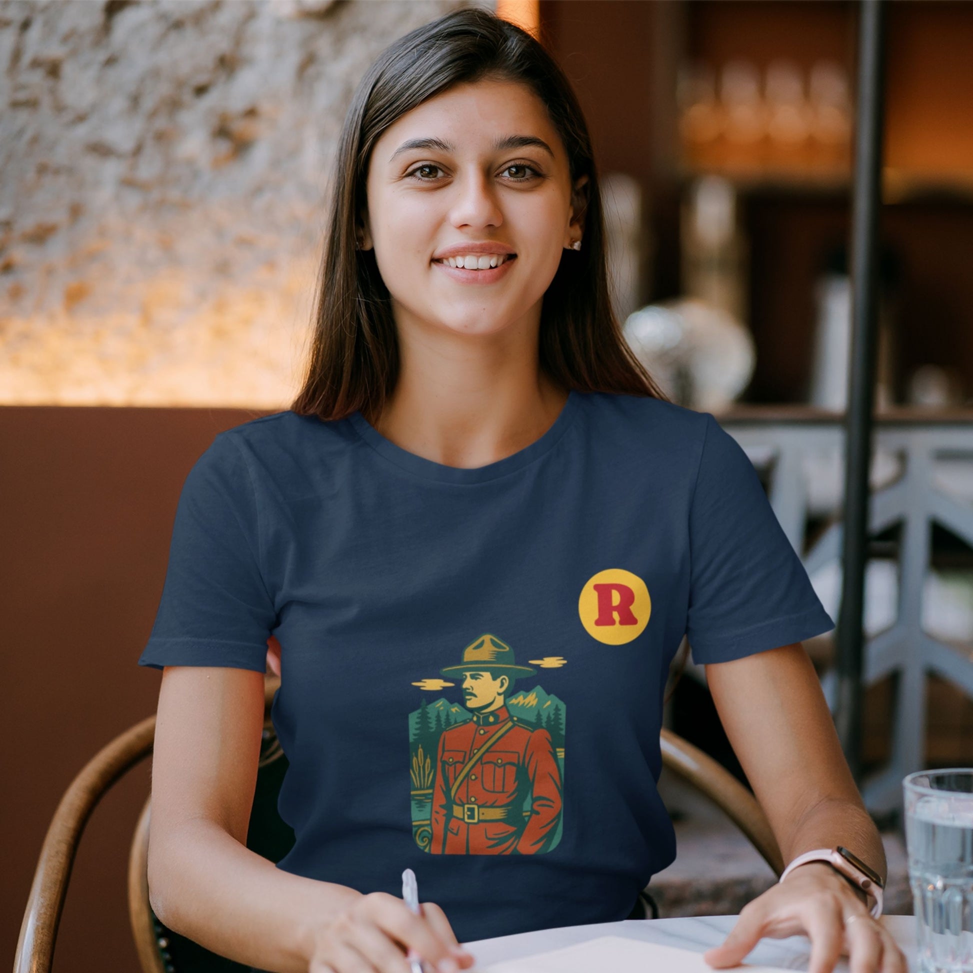 Woman wearing a RCMP Canada T Shirt in Navy colour from the Canadian Alphabet collection by Maple Beaver
