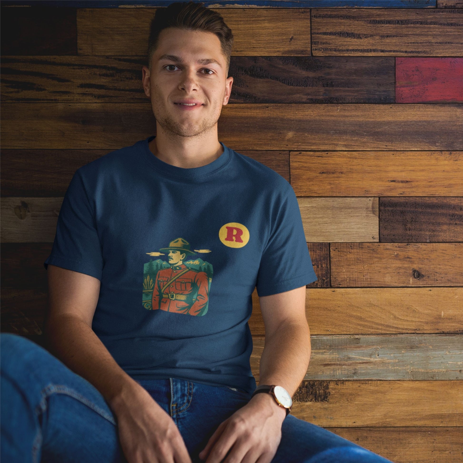 Man wearing a RCMP Canada T Shirt in Navy colour from the Canadian Alphabet collection by Maple Beaver
