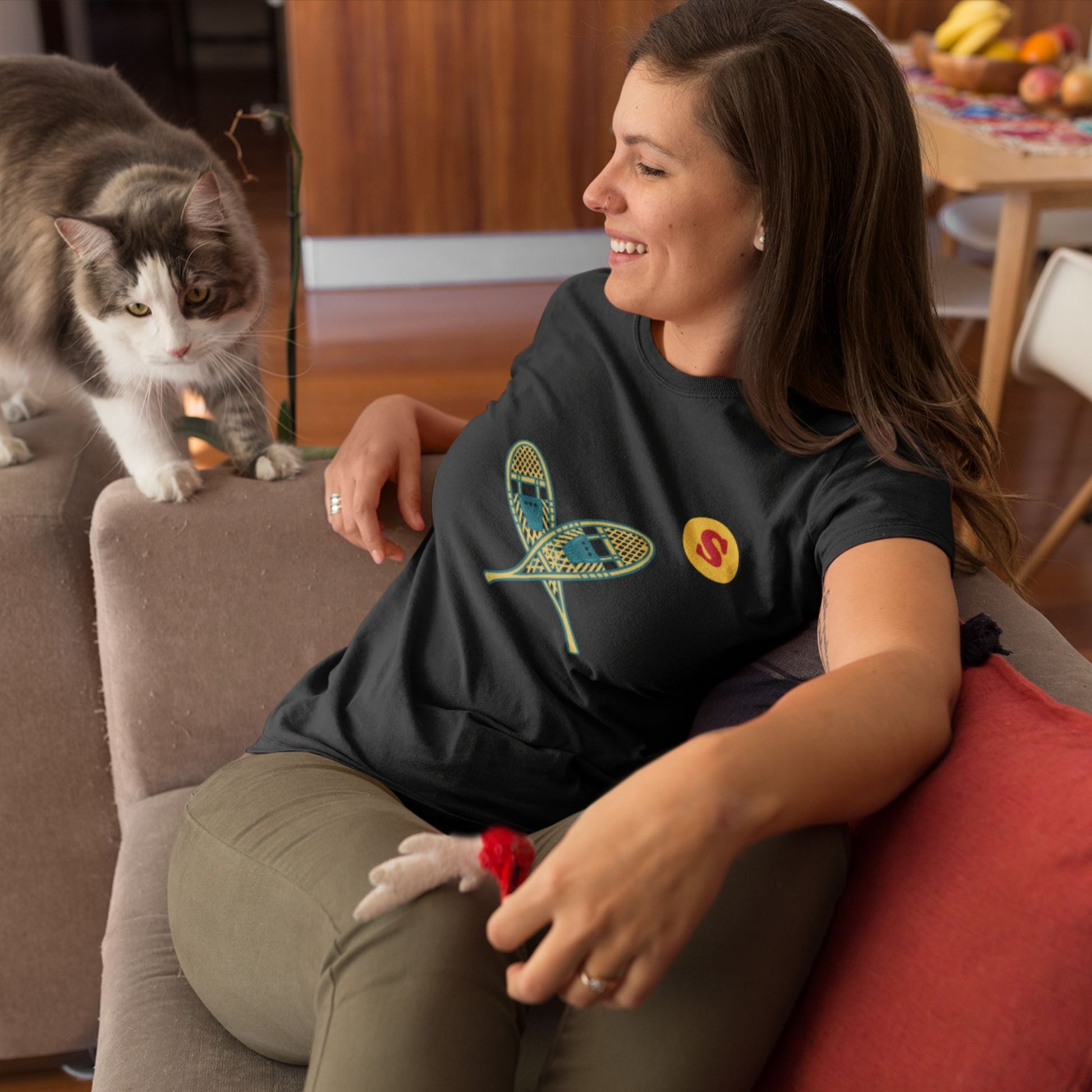 Woman wearing a Canadian Made Black colour T Shirt with Snowshoes  from the Canadian ABC collection by Maple Beaver
