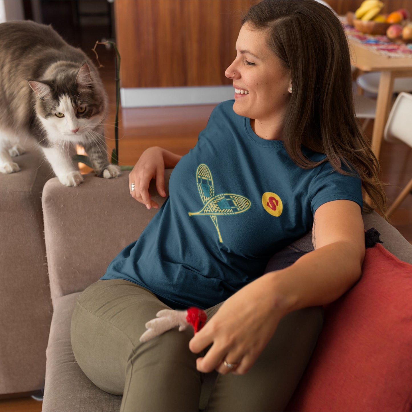 Woman wearing a Canadian Made Navy Blue colour T Shirt with Snowshoes  from the Canadian ABC collection by Maple Beaver