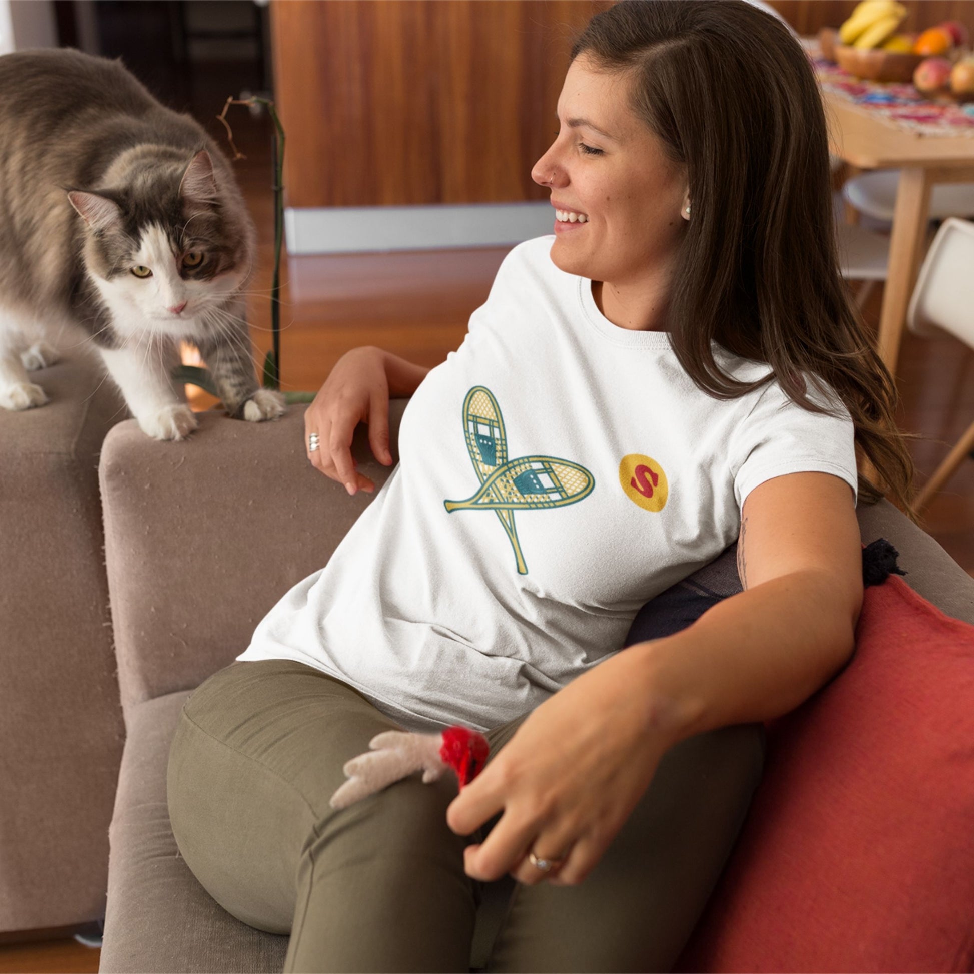 Woman wearing a Canadian Made White colour T Shirt with Snowshoes  from the Canadian ABC collection by Maple Beaver