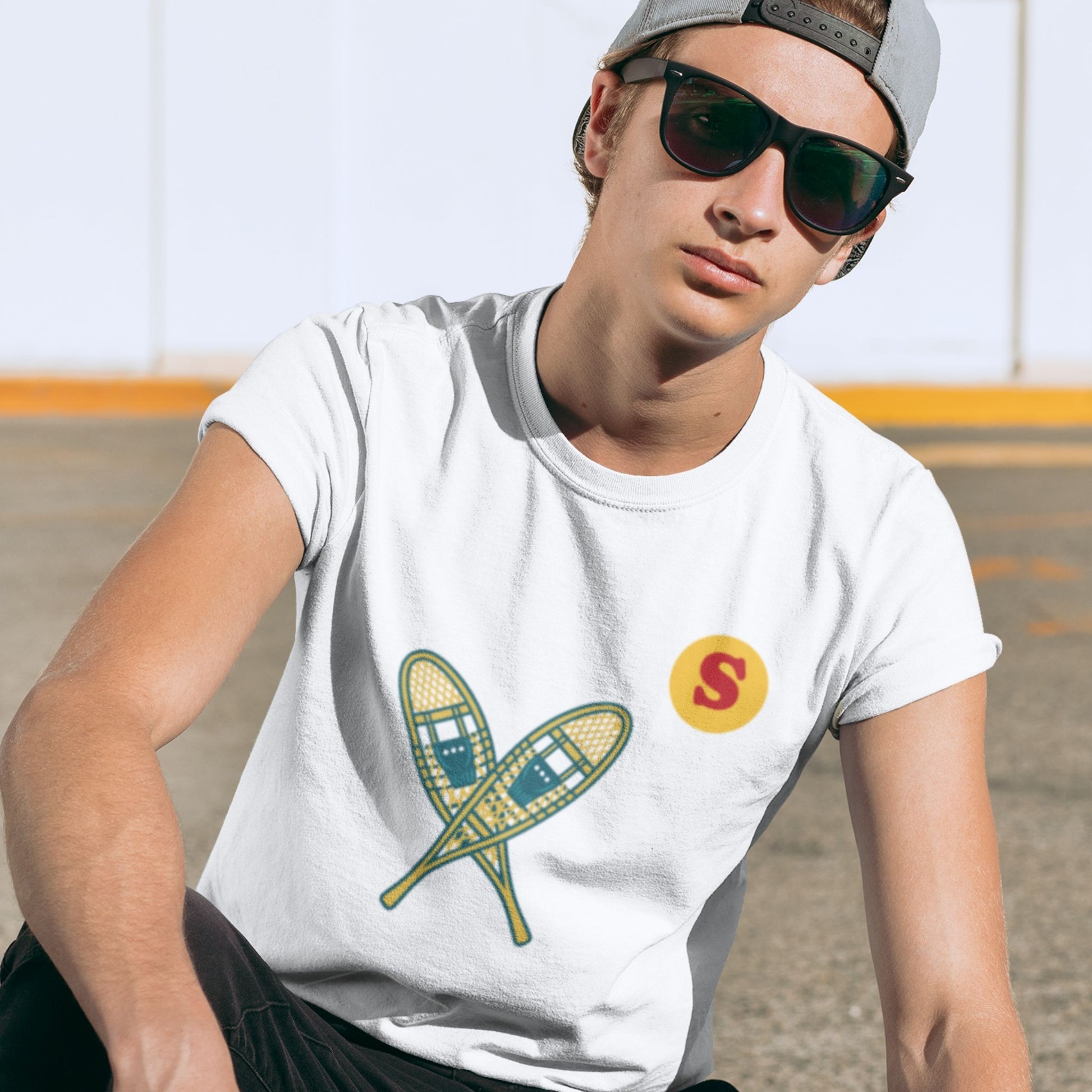 Man wearing a Canadian Made White colour T Shirt with Snowshoes  from the Canadian ABC collection by Maple Beaver