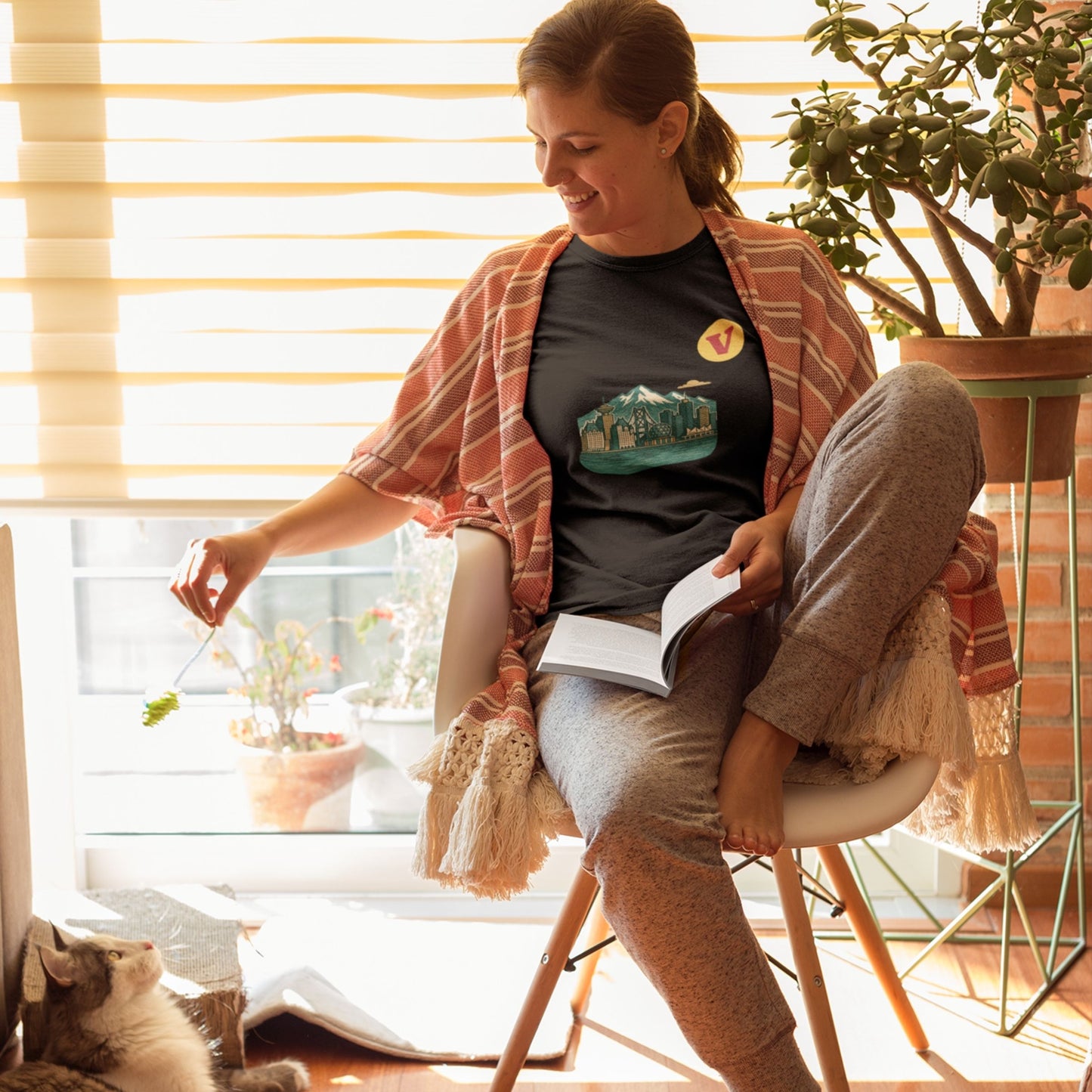 Woman wearing the Vancouver Canada T Shirt in Navy colour from the Canadian ABC collection by Maple Beaver. Made in Canada in Organic Cotton.