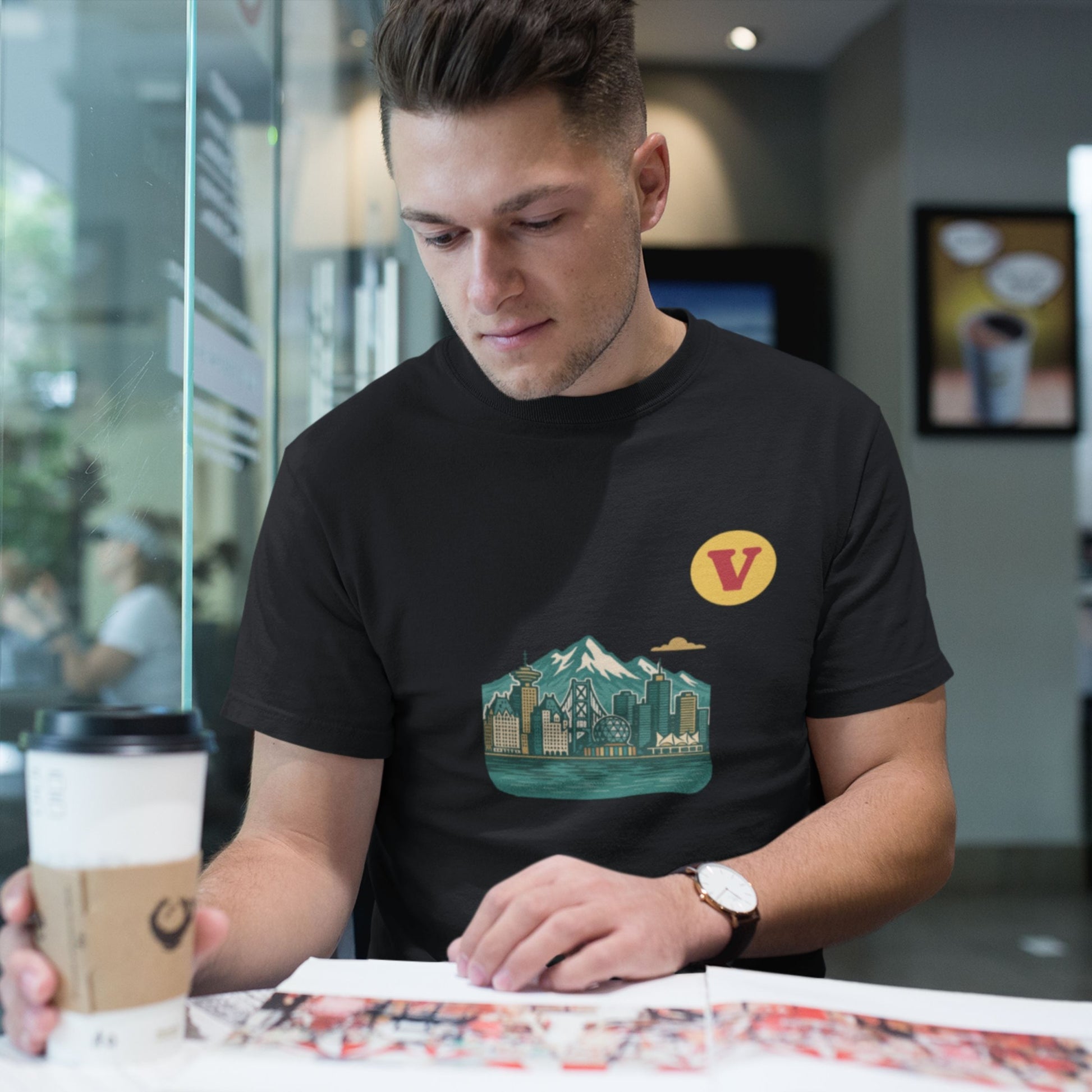 Man wearing the Vancouver Canada T Shirt in Black colour from the Canadian ABC collection by Maple Beaver. Made in Canada in Organic Cotton.