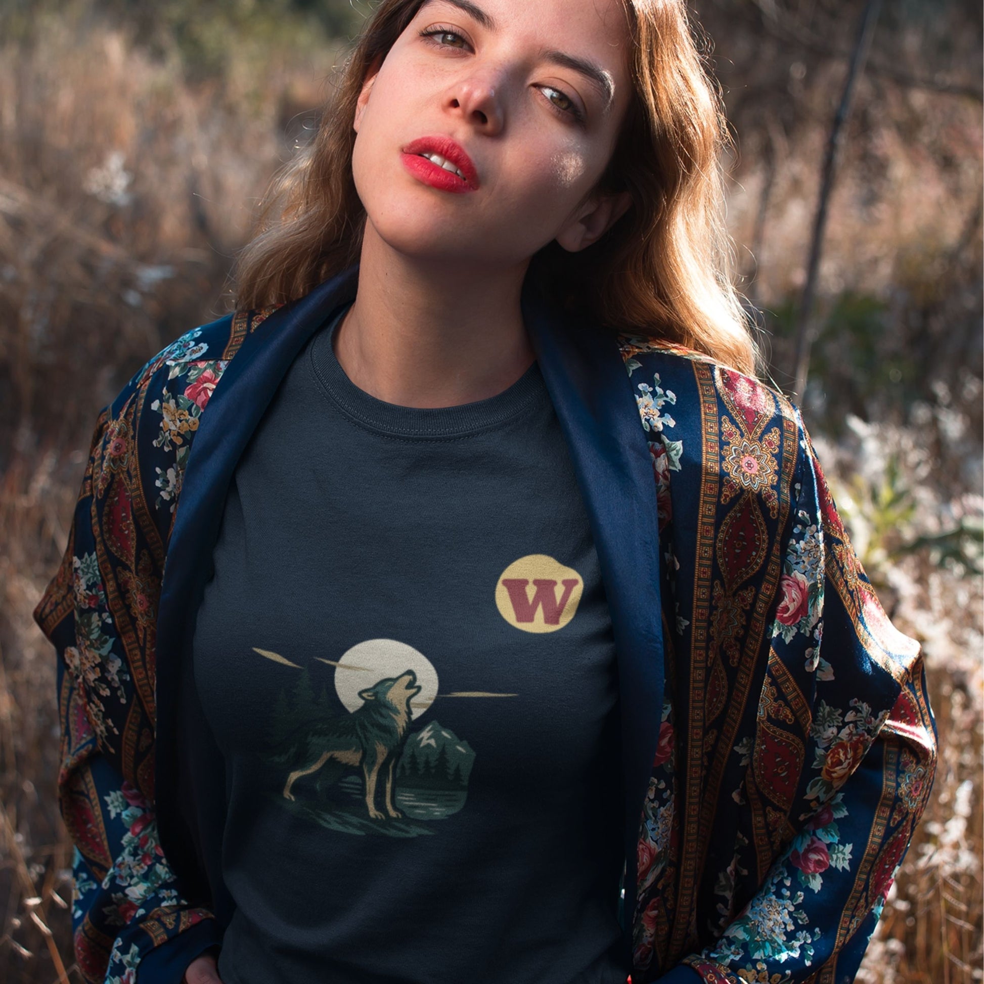 Woman wearing the Made in Canada Wolf T Shirt in Navy colour from the Canadian ABC collection by Maple Beaver