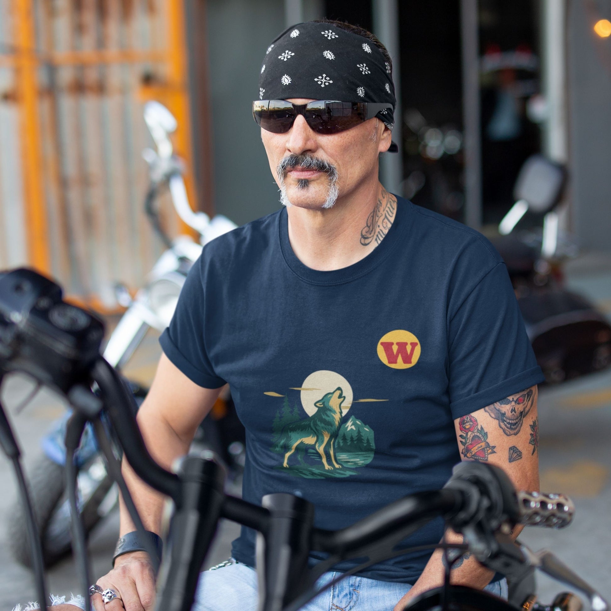 Man wearing the Made in Canada Wolf T Shirt in Navy colour from the Canadian ABC collection by Maple Beaver