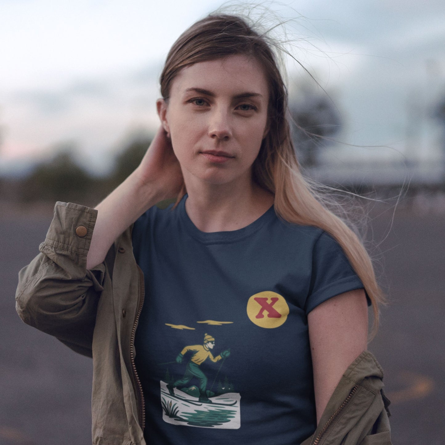 Woman wearing the Canadian Made organic cotton cross country Skiing T shirt  in Navy colour from the Canadian Alphabet collection by Maple Beaver