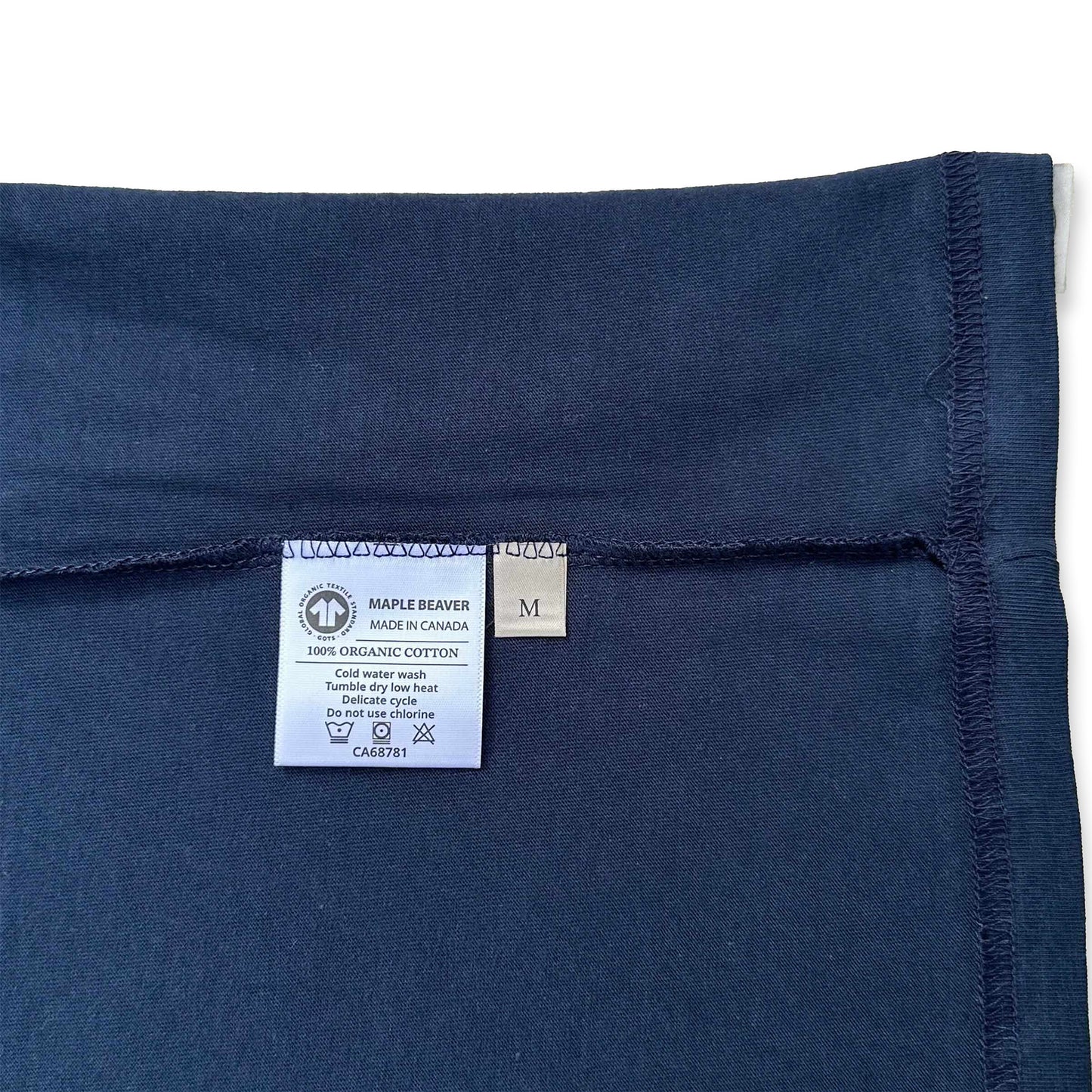 Canadian Made Organic Cotton T shirt in Navy colour by Maple Beaver, closeup of care label.