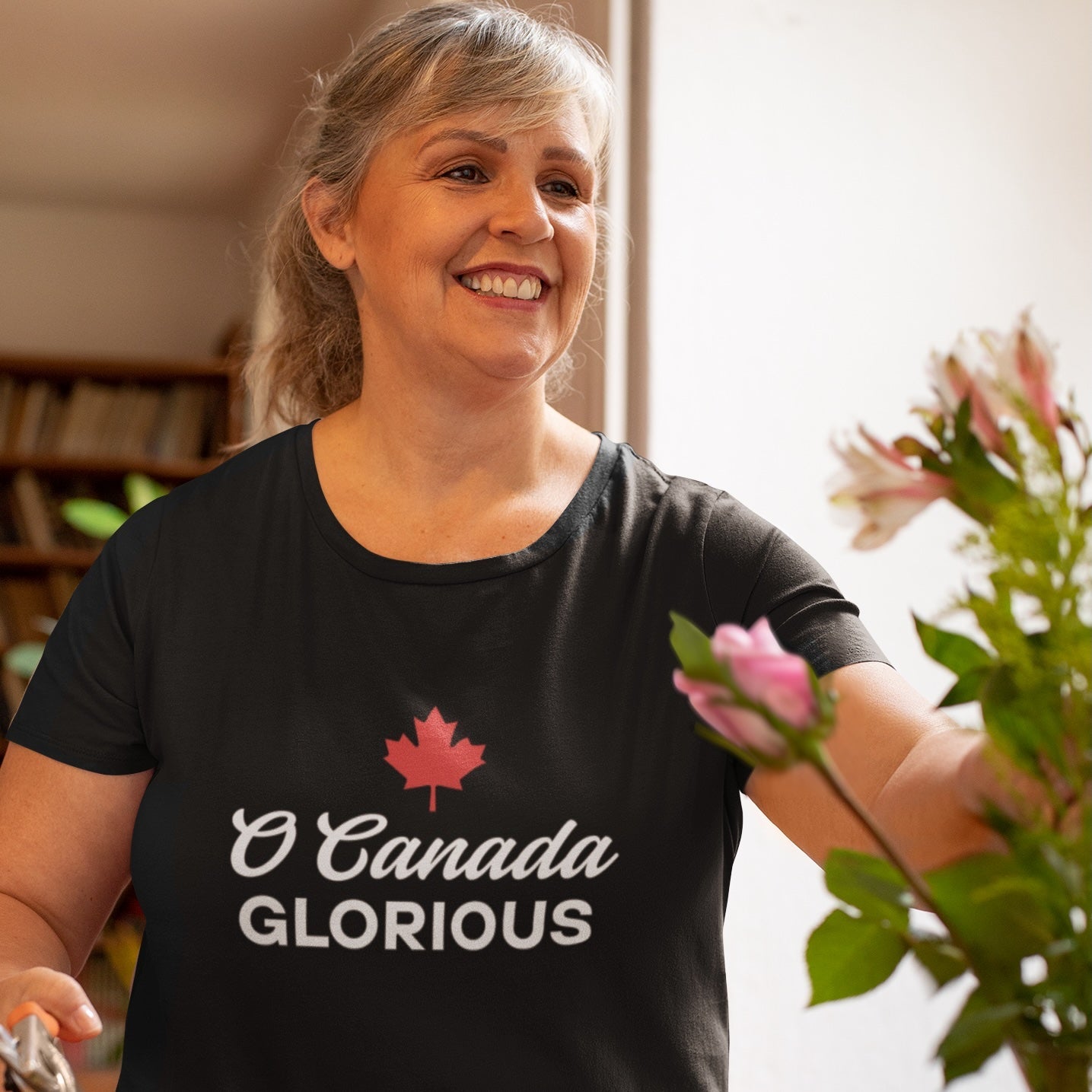 Woman wearing the O Canada Glorious Canadian TShirt in Black colour by Maple Beaver.