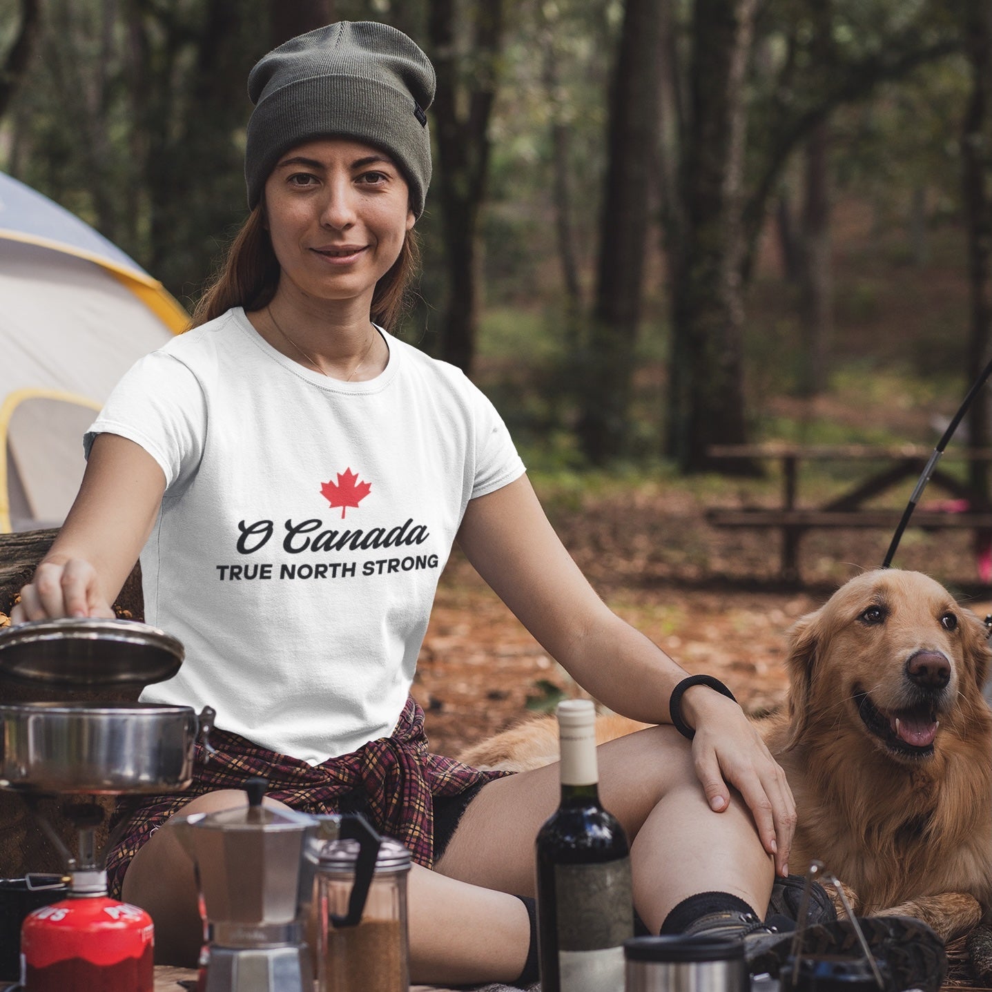 Woman at a campsite wearing the True North Strong Canadian T Shirt in White colour by Maple Beaver.