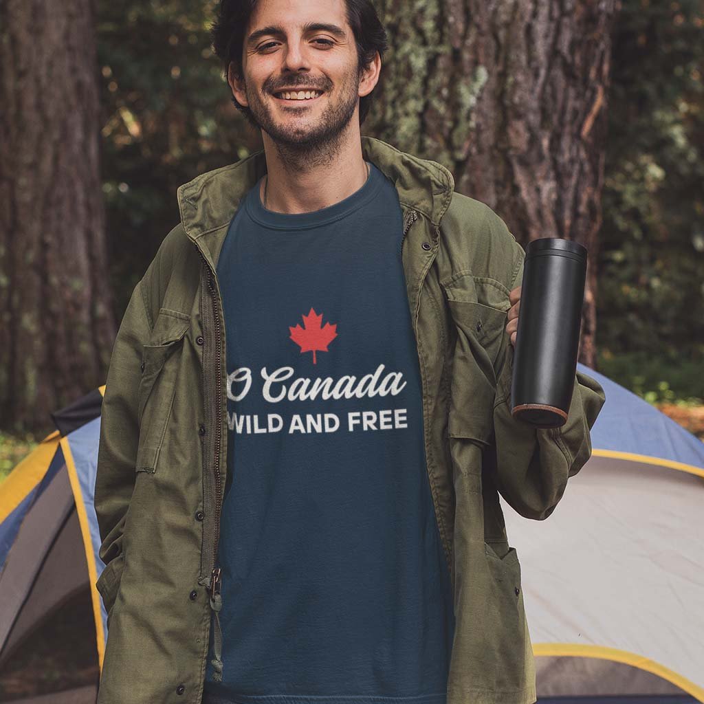 Man wearing the O Canada Wild and Free  Canadian TShirt in Navy colour by Maple Beaver.