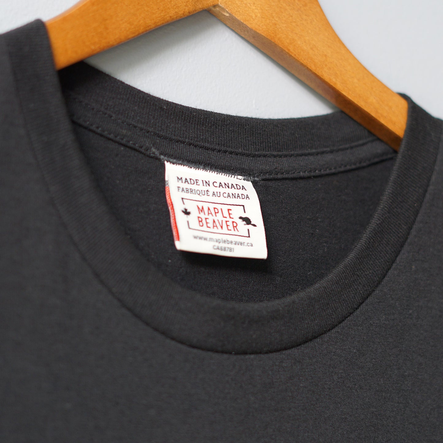 Canadian Made Organic Cotton T shirt in Black color by Maple Beaver, closeup of crew neck.