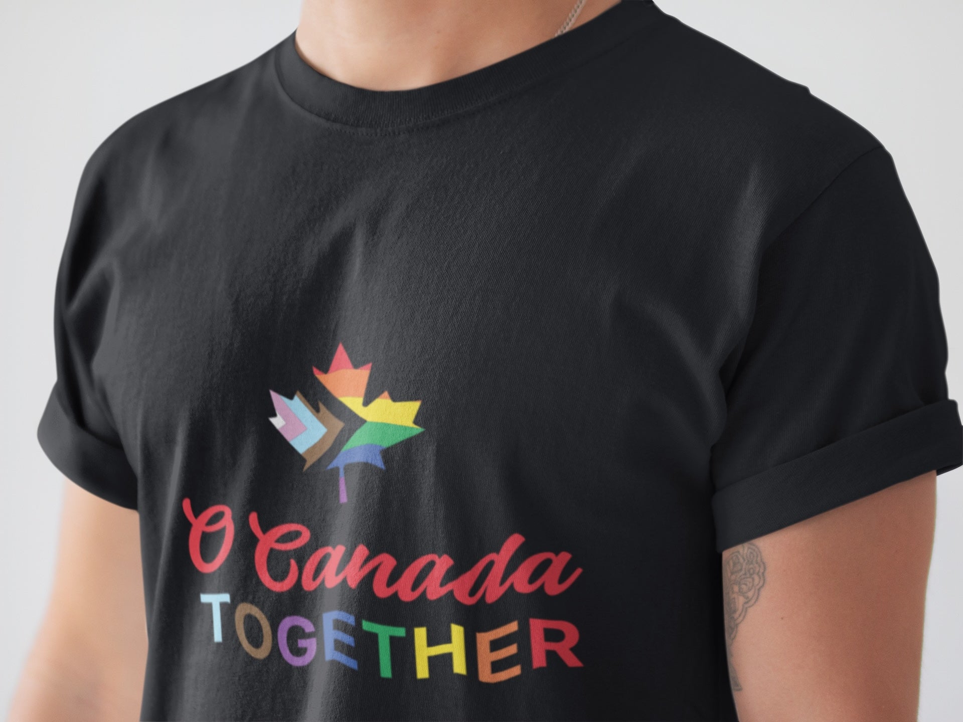 front closeup of a man wearing the pride t shirt in black colour by Maple Beaver