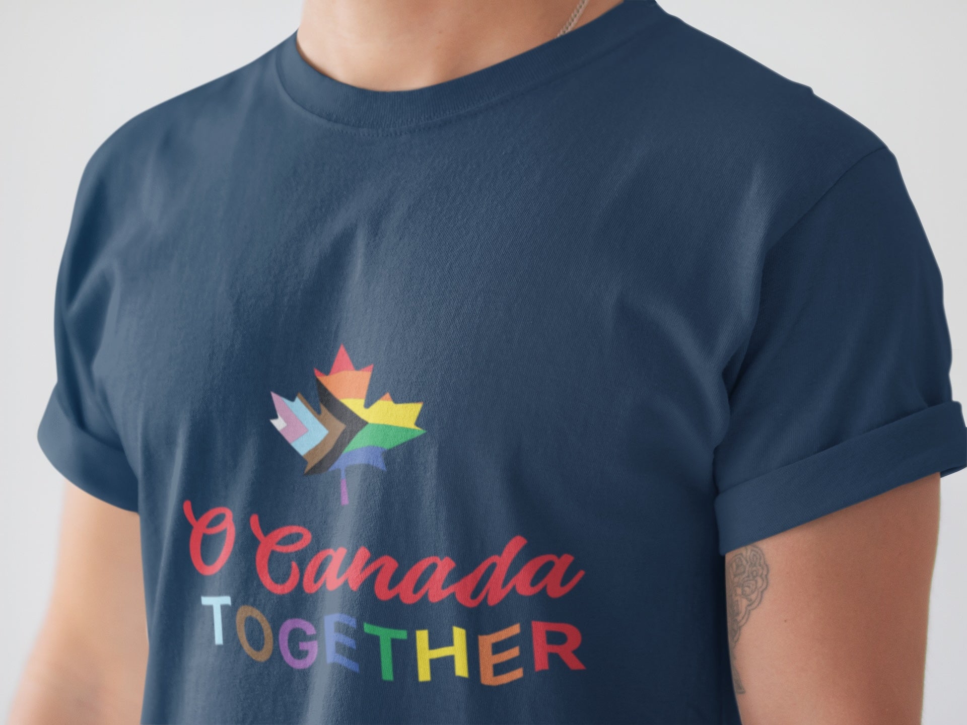 front closeup of a man wearing the pride t shirt in navy colour by Maple Beaver