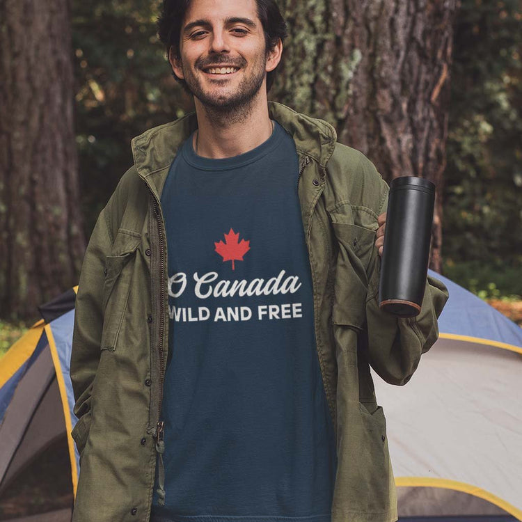 Man wearing the O Canada Wild and Free  Canadian TShirt in Navy colour by Maple Beaver.