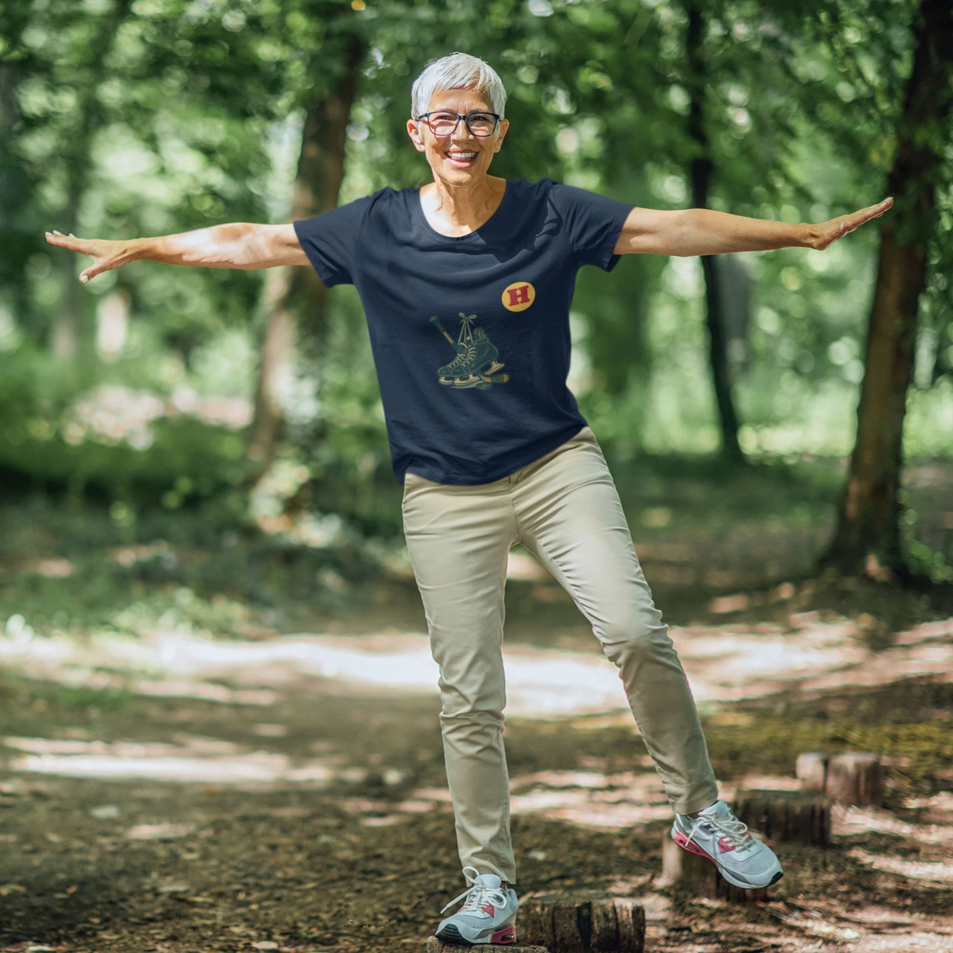 Woman wearing a Navy colour Canadian Made Hockey T Shirt in Organic Cotton from the Canadian ABC collection by Maple Beaver