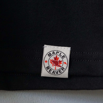 Canadian Made Organic Cotton T shirt in Black colour by Maple Beaver, closeup of bottom hem.