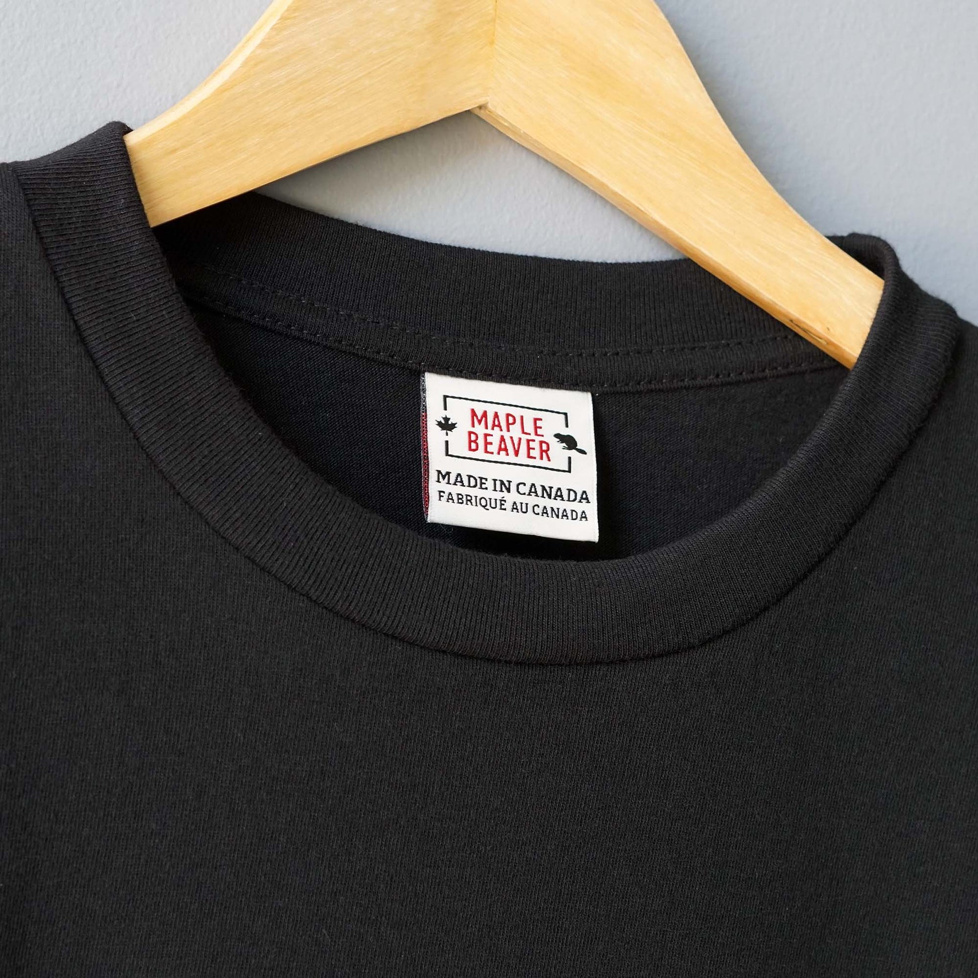 Canadian Made Organic Cotton T shirt in Black color by Maple Beaver, closeup of crew neck.